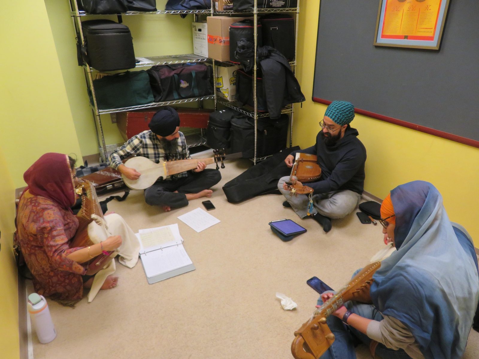 Students and teachers practicing dilruba and sarangi at GAISS