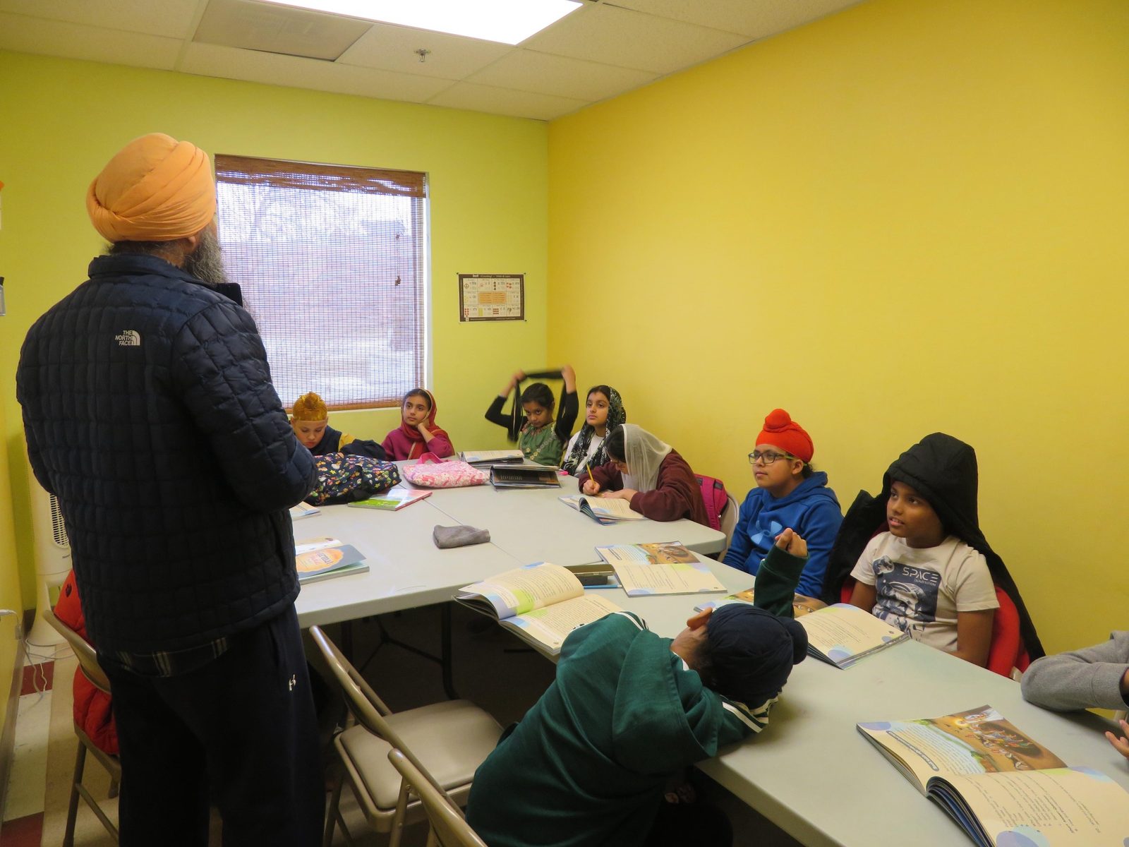 A teacher leading a Sikh heritage discussion class at GAISS